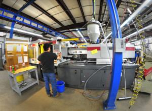 An injection molding press at CY Plastics. The Ontario County, NY manufacturer will add another injection molding press as well as automated handling equipment to support the new agreement and additional growth